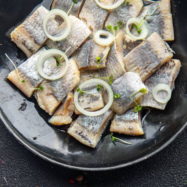 herring salted piece plate seafood fish meal food snack on the table copy space food background