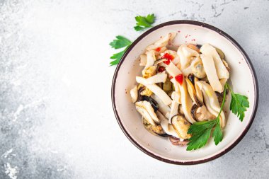 seafood salad mussels, squid, octopus, shrimps meal food snack on the table copy space food background