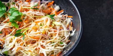 coleslow salad cabbage vegetable carrot, onion, greens healthy meal food snack on the table copy space food background rustic top view keto or paleo diet veggie vegan or vegetarian