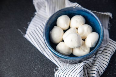 mozzarella small balls cow's milk or buffalo, goat healthy meal food snack on the table copy space food background rustic top view