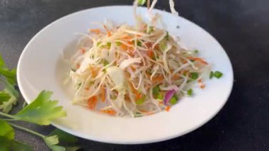 coleslow salad cabbage vegetable carrot, onion, greens healthy meal food snack on the table copy space food background rustic top view keto or paleo diet veggie vegan or vegetarian