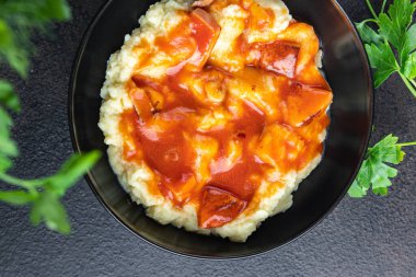 mashed potatoes tomato sauce roast sausage healthy meal food snack on the table copy space food background rustic top view