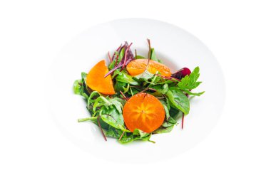 hurma salatası marul yeşil yapraklar masada sağlıklı yemek atıştırmalıkları fotokopi alanı arka planı vejetaryen veya vejetaryen yemekleri karıştırır.