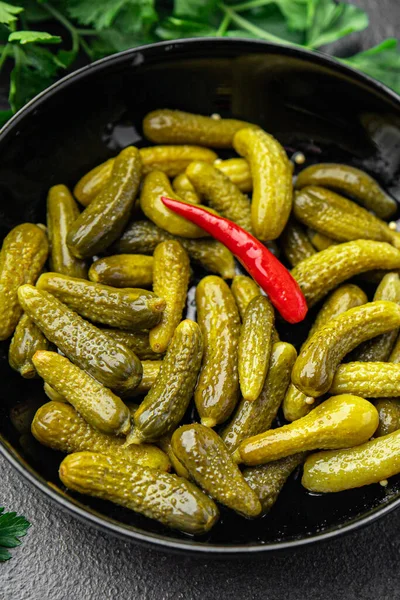 gherkins salted cucumbers pickled vegetables in a bowl fresh portion healthy meal food diet snack on the table copy space food background keto or paleo diet veggie vegan or vegetarian food