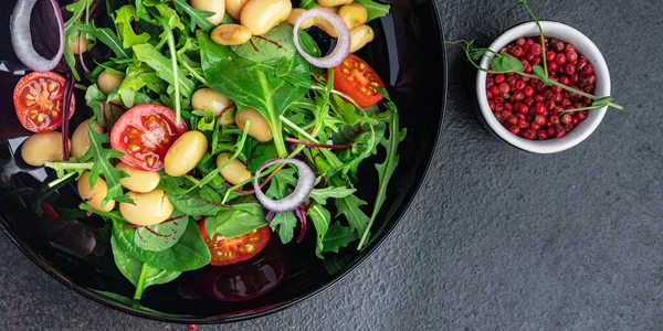 salad white bean tomato, leaves mix lettuce fresh healthy meal diet snack on the table copy space food background