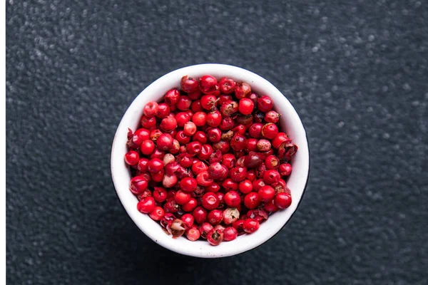 pink peppercorn pepper allspice peppercorns  spices healthy meal food diet snack on the table copy space food background rustic top view