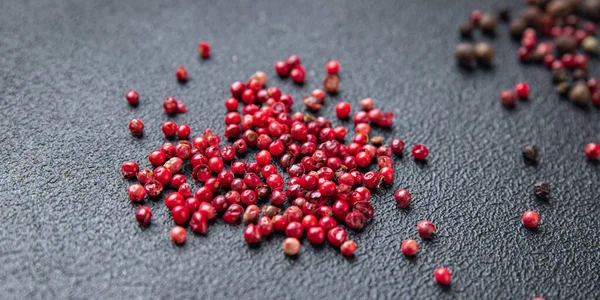 pink peppercorn pepper allspice peppercorns  spices healthy meal food diet snack on the table copy space food background rustic top view