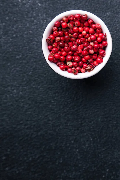 pink peppercorn pepper allspice peppercorns  spices healthy meal food diet snack on the table copy space food background rustic top view