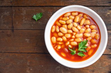 Fasulye sosu fasülye fasulyesi taze sağlıklı yemek abur cubur diyeti masada fotokopi uzayı yemek arka plan kırsal üst görüş keto veya paleo diyet vejetaryen veya vejetaryen yemeği et yok.