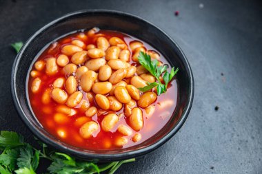 Fasulye sosu fasülye fasulyesi taze sağlıklı yemek abur cubur diyeti masada fotokopi uzayı yemek arka plan kırsal üst görüş keto veya paleo diyet vejetaryen veya vejetaryen yemeği et yok.