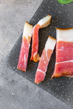 smoked belly meat Schwarzwald ham fresh healthy meal food snack diet on the table copy space food background rustic top view