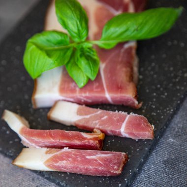 smoked belly meat Schwarzwald ham fresh healthy meal food snack diet on the table copy space food background rustic top view