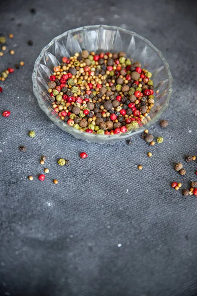 peppercorn 5 spices red, black, green and white pepper, coriander fresh food spice on the table copy space food background 