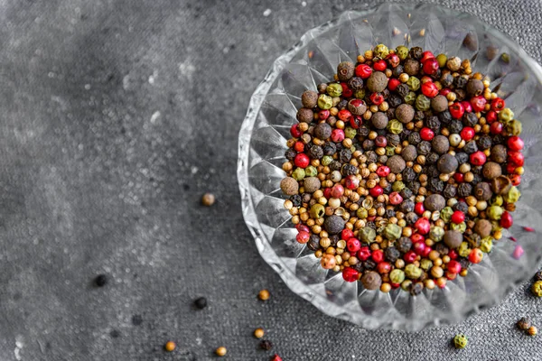 peppercorn 5 spices red, black, green and white pepper, coriander fresh food spice on the table copy space food background 