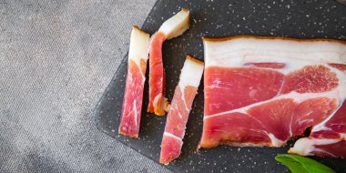 smoked belly meat Schwarzwald ham fresh meal food snack on the table copy space food background 
