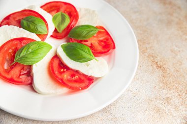 caprese mozzarella salad and basil tomato fresh dish healthy meal food snack diet on the table copy space food background rustic top view keto or paleo diet veggie vegetarian food