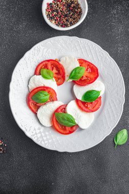 caprese mozzarella salad and basil tomato fresh dish healthy meal food snack diet on the table copy space food background rustic top view keto or paleo diet veggie vegetarian food