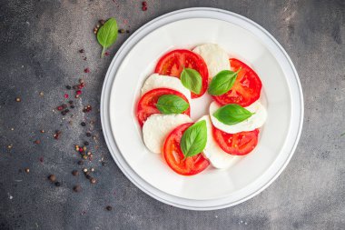 caprese mozzarella salad and basil tomato fresh dish healthy meal food snack diet on the table copy space food background rustic top view keto or paleo diet veggie vegetarian food