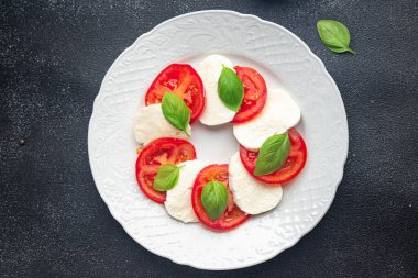 caprese mozzarella salad and basil tomato fresh dish healthy meal food snack diet on the table copy space food background rustic top view keto or paleo diet veggie vegetarian food