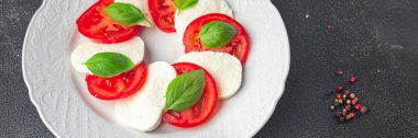 caprese mozzarella salad and basil tomato fresh dish healthy meal food snack diet on the table copy space food background rustic top view keto or paleo diet veggie vegetarian food