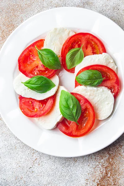 caprese mozzarella salad and basil tomato fresh dish healthy meal food snack diet on the table copy space food background rustic top view keto or paleo diet veggie vegetarian food