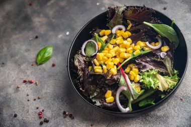 corn salad green lettuce mix fresh dish healthy meal food snack diet on the table copy space food background rustic top view keto or paleo diet veggie vegan or vegetarian food no meat