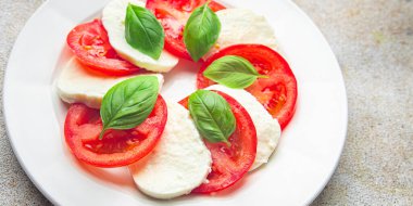 caprese salad mozzarella and basil tomato fresh meal food snack on the table copy space food background
