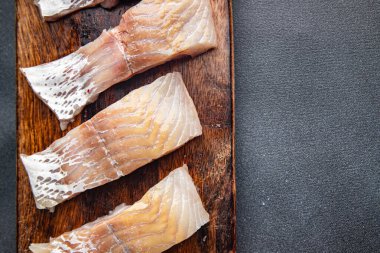 fish saithe raw seafood fillet fresh dish healthy meal food snack on the table copy space food background 
