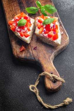 bruschetta basil tomato sandwich snack vegetables healthy meal food snack diet on the table copy space food background rustic top view veggie vegan or vegetarian food