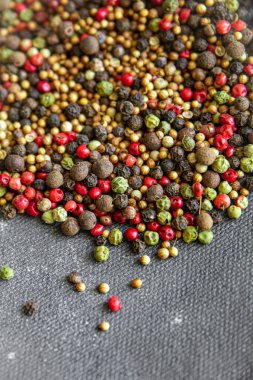 pepper peppercorn 5 spices red, black, green and white pepper, coriander food spice on the table copy space food background 