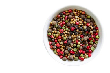 pepper peppercorn 5 spices red, black, green and white pepper, coriander food spice on the table copy space food background 