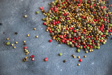 pepper peppercorn 5 spices red, black, green and white pepper, coriander food spice on the table copy space food background 