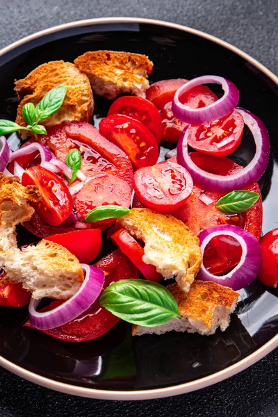 panzanella salad vegetables tomato, dried bread, onion healthy meal food snack diet on the table copy space food background rustic top view
