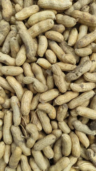 Peanut in the shell. Food background of peanuts, healthy vegan food