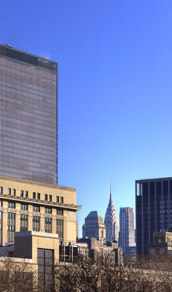 The Chrysler building is to be seen among other highrise buildings of Manhattan.