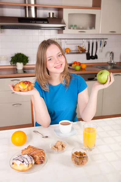 Young woman chooses healthy diet Royalty Free Stock Photos