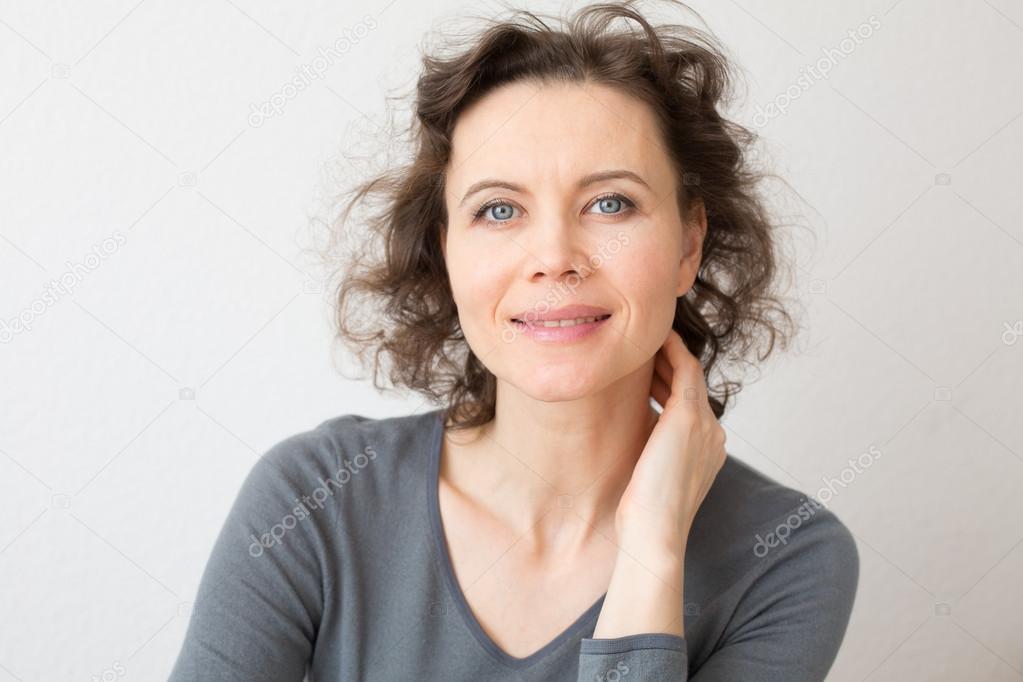 Romantic woman looking into camera with smile