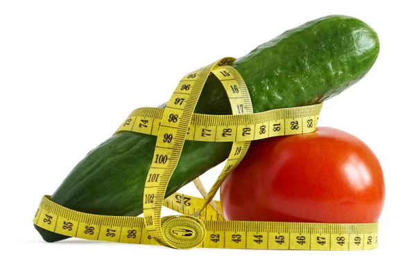 Cucumber and tomato with measuring tape — Stock Photo, Image