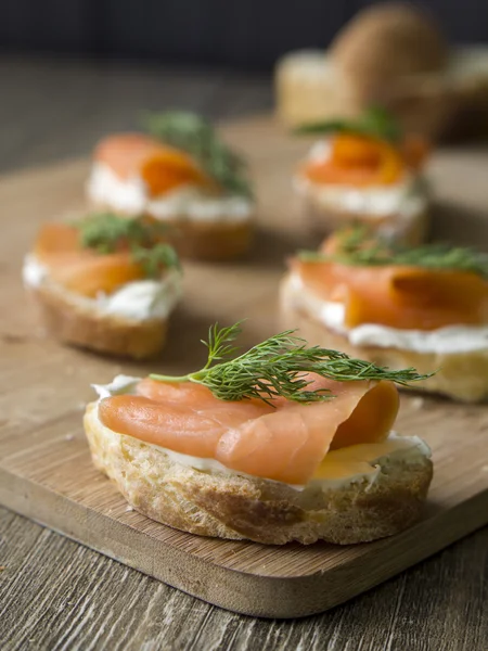 Salmon sandwiches on homemade baguette — Stock Photo, Image