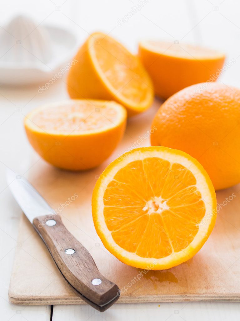 Fresh oranges on a cutting board