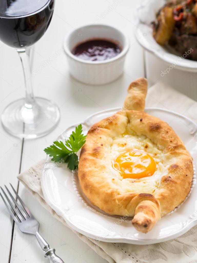 Ajaruli khachapuri - Georgian bread with egg and cottage cheese