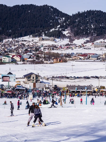 BAKURIANI, GEORGIA - JANUARY 09, 2014: People doing winter sports in Bakuriani, Georgia, on a January weekend. Bakuriani is one of two most popular skiing resorts in the country