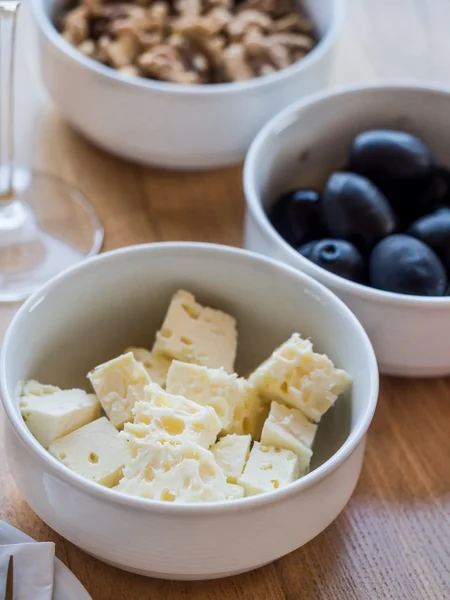 Cheese, nuts and olives — Stock Photo, Image