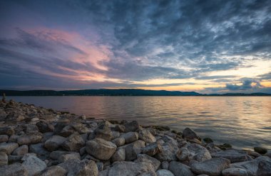 Stones on the shore of Lake Constance at sunset