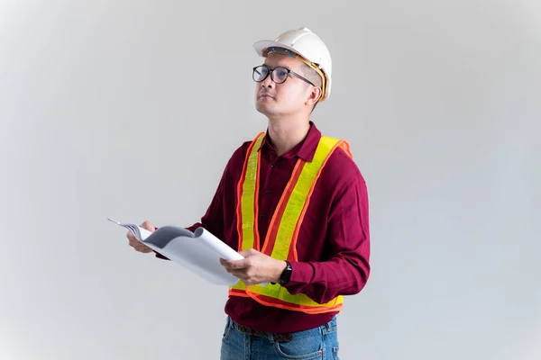 Architect builder studying layout plan of the rooms, civil engineer checking work with  blueprints in a studio. Architect, Engineer, Civil Concept of Construction.