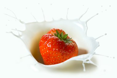 Red strawberry falling into the milk clipart