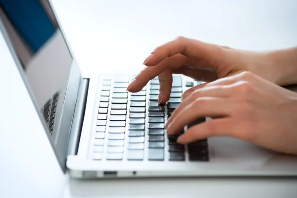 Businesswoman typing on laptop — Stock Photo, Image