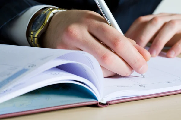 Businessman making notes — Stock Photo, Image