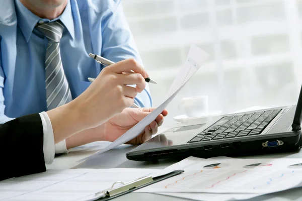 Business partners hands over papers — Stock Photo, Image