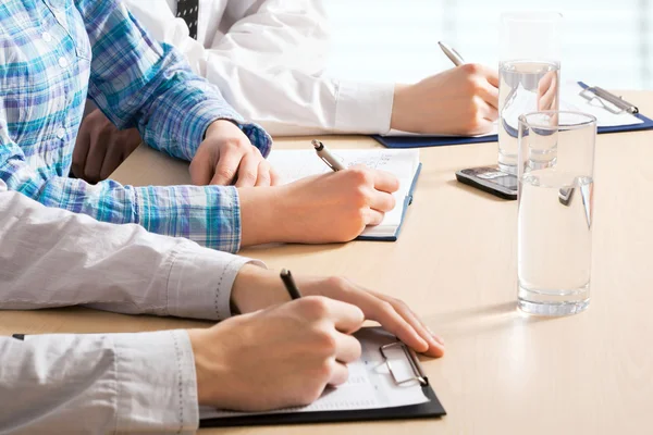 Business people writing notes — Stock Photo, Image